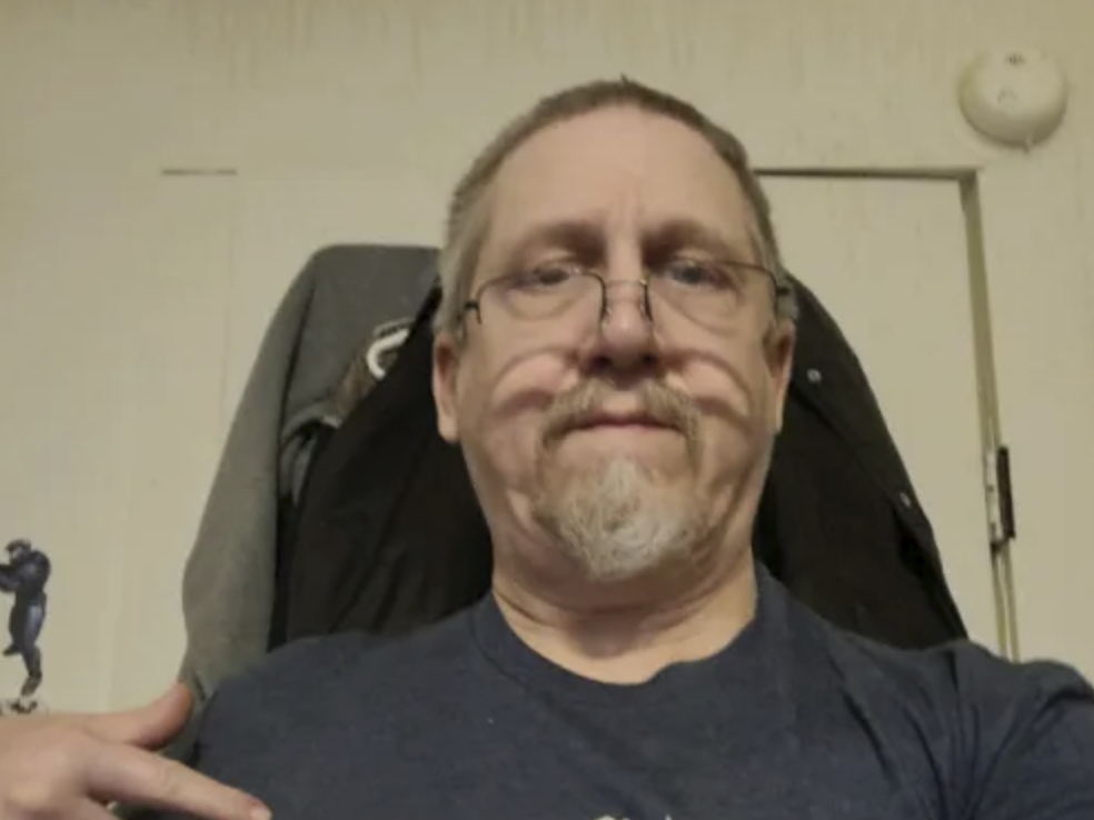 picture of Ronald B. in front of a house