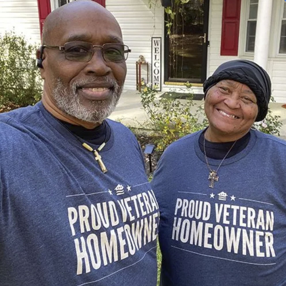 picture of Reginald F. in front of a house